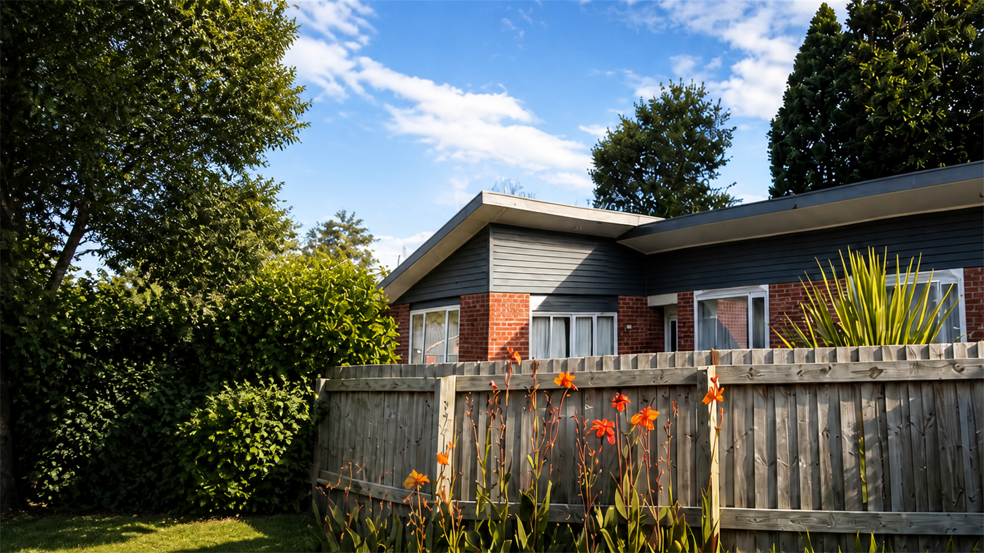 Freshly repainted Christchurch weatherboard home under a blue sky